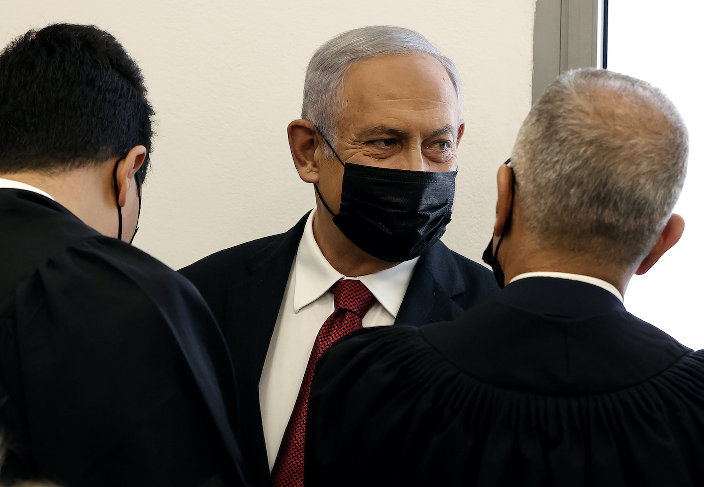 Netanyahu appears in court as ex-aide prepares to take stand