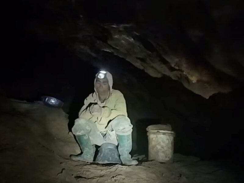 Rescuers evacuate the first of 5 villagers found trapped in a cave in Laos; 2 still missing