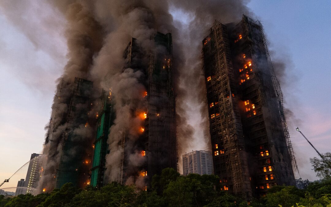 Hong Kong charges 7 people and 2 firms over massive fire that killed 168